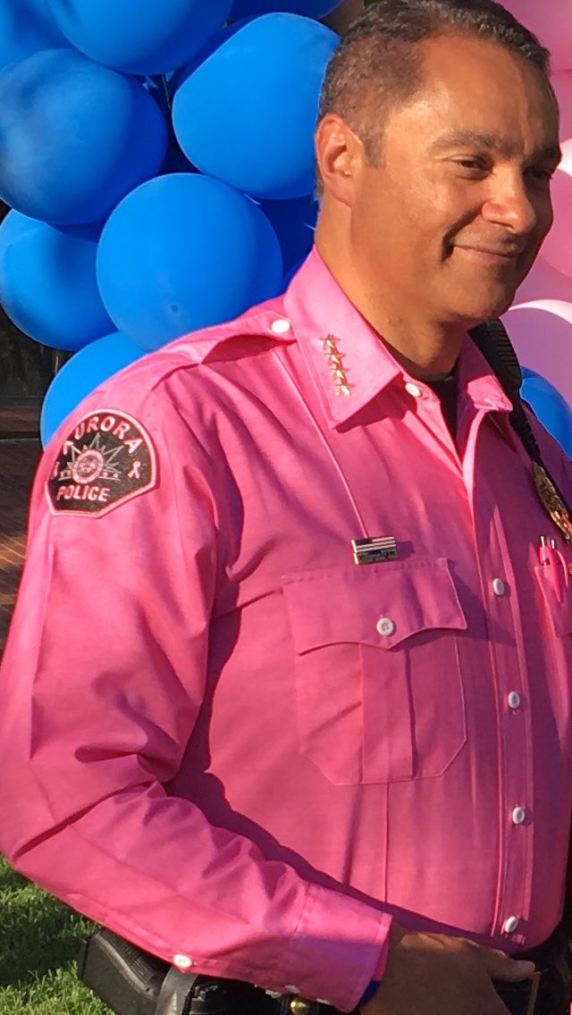 AuroraPD's tweet image. #BlueGoesPink Real men wear pink! Chief Metz wearing his special uniform shirt today for the Breast Cancer Awareness Ribbon formation today.