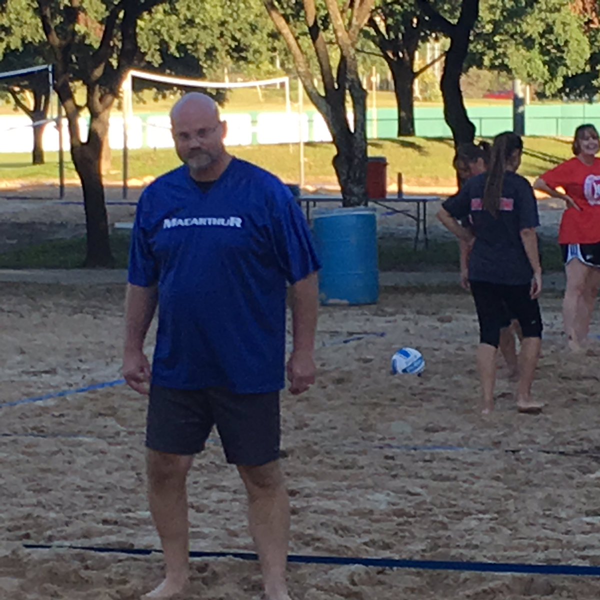 Assistant Principal Dennis Rudnick stalks the sand volleyball court helping his MacArthur Brahmas in their first night of competition.