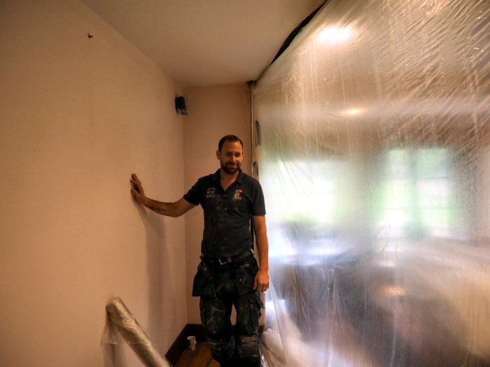 Before the plaster is removed Ryan has erected a screen to keep dust from the rest of the room