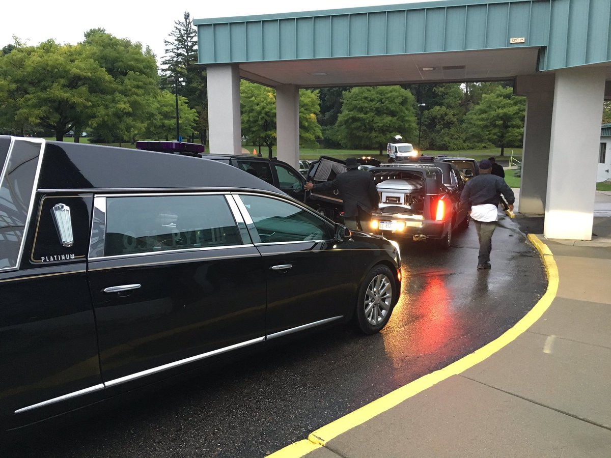 Four caskets arrive for funeral of children killed last week in domestic violence rampage in Dearborn Heights.