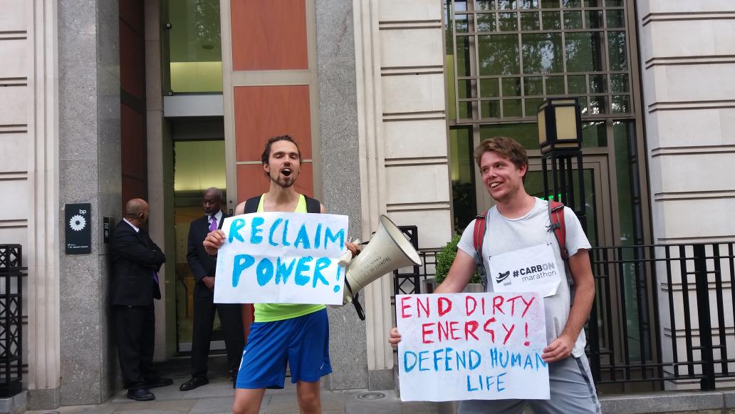 CarbonMarathon's tweet image. We are outside BP who have barricaded their door to prevent our action.  #CarbonMarathon #ReclaimPower
