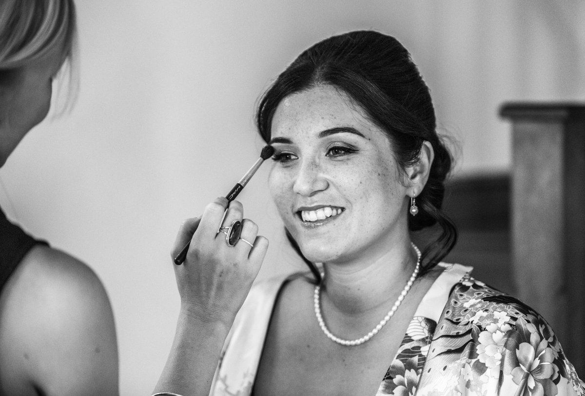 Applying the last sweeps of eyeshadow on Tracey before she gets into her dress #makeup #hair @CrockwellFarm makeupmyweddingday.com
