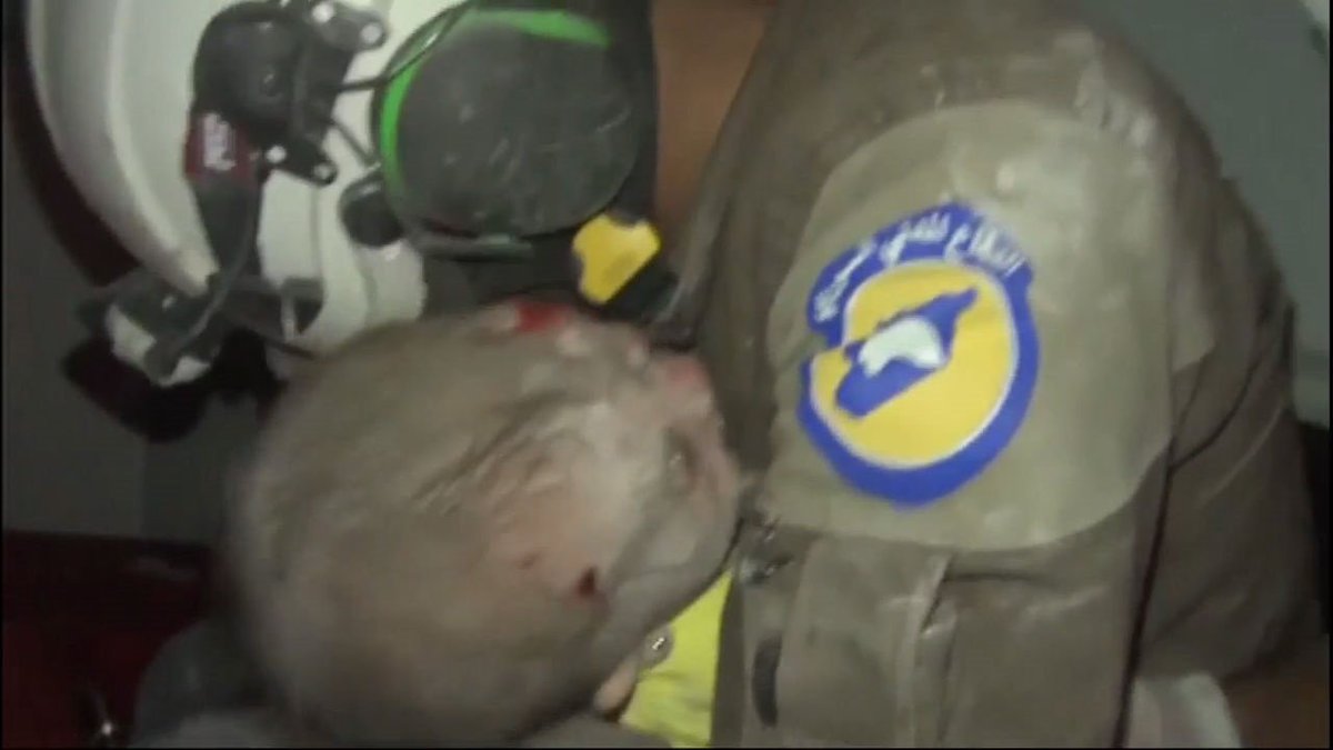 Independent_ie's tweet photo. #WATCH The shocking moment a one-month-old baby pulled from the rubble in Syria - https://t.co/GDxeWH2bDi https://t.co/iEsSTDNPHe