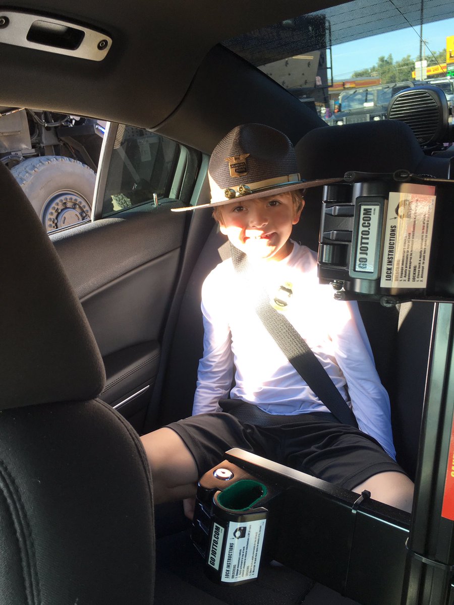 OHPLTKera's tweet photo. Sometimes our Troopers need an extra hand...or two! Cash was my copilot at the and helped me wave during the parade! #cashcopilot #OHP https://t.co/oUL199n6UJ