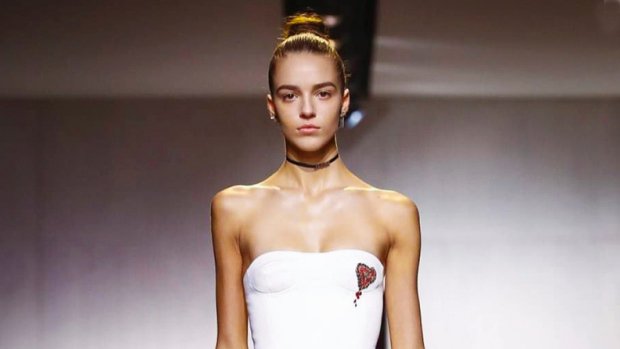 Teen model with scoliosis inspires by strutting down Paris runway months after surgery