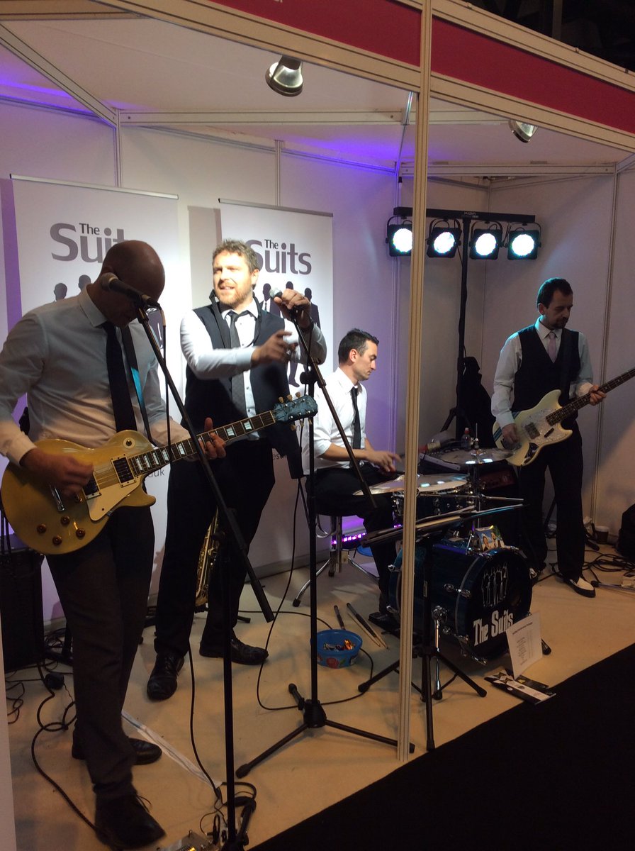 BridalRelovedSa's tweet photo. @TheSuitsBand keeping us entertained @nationalwedding on day 2! Fab guys.

#bridalrelovedsawston #TNWS #cambridge #weddingdresses https://t.co/lbe6GX1spt