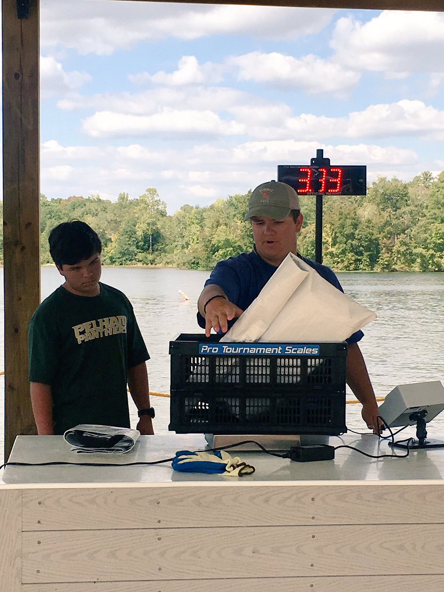 Christina9418's tweet photo. Darren &amp; Garrett weighing in at the high school bass fishing tournament! #pantherfamily @gbates319 @DarrenDdog99 https://t.co/8FdRh353yK
