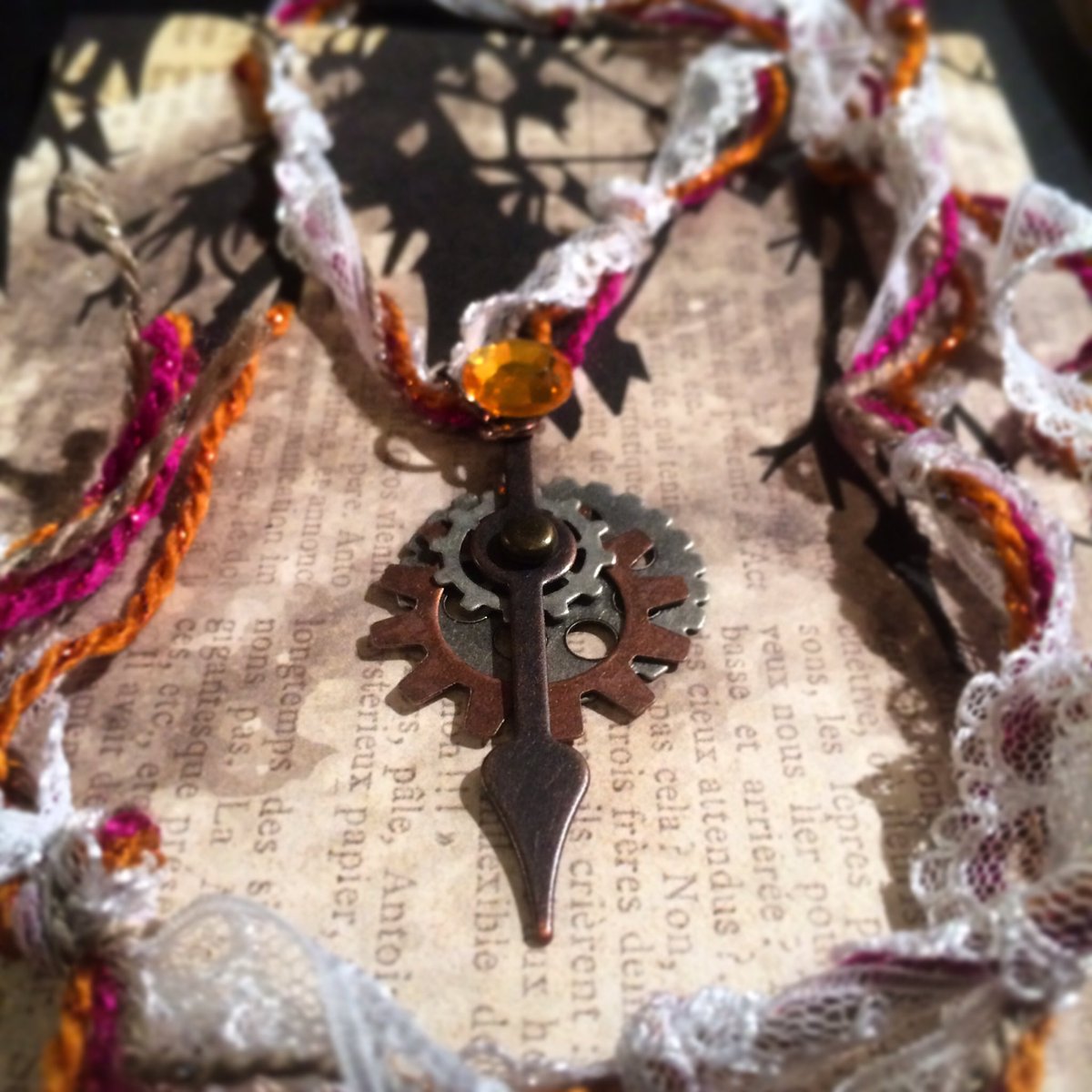 CuriouserSeries's tweet photo. White Rabbit's #clockwork #gear #thread #necklace in gold/fuchsia/white lace in my @etsy shop. https://t.co/yAaNdHOjw7 https://t.co/eCVpWiYR7k