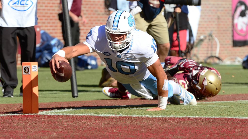 UNCFootball's tweet photo. Here's how today's 37-35 win looked through the lens of @JCamarati: https://t.co/odAMDAo6mN #RaiseUpCarolina https://t.co/s6g1A5U5da