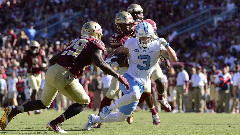 UNCFootball's tweet photo. Here's how today's 37-35 win looked through the lens of @JCamarati: https://t.co/odAMDAo6mN #RaiseUpCarolina https://t.co/s6g1A5U5da