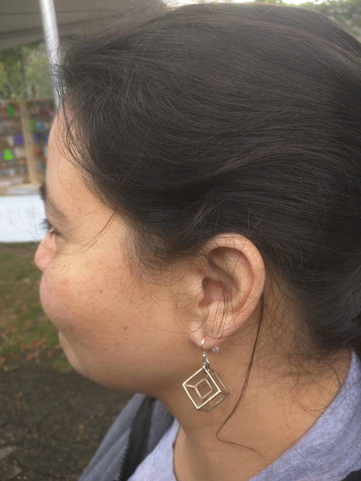 simplyhula's tweet photo. @tblatt Love my beautiful metal tesseract earrings! NY World Maker Faire 2016 https://t.co/SYEzmN5w9R