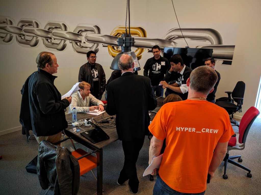 HollandFinTech's tweet photo. Instant clearing, instant reporting, we saw it all.  Jury is now visiting individual teams to prepare their instant judgment #HackITon https://t.co/bsN6gccmga
