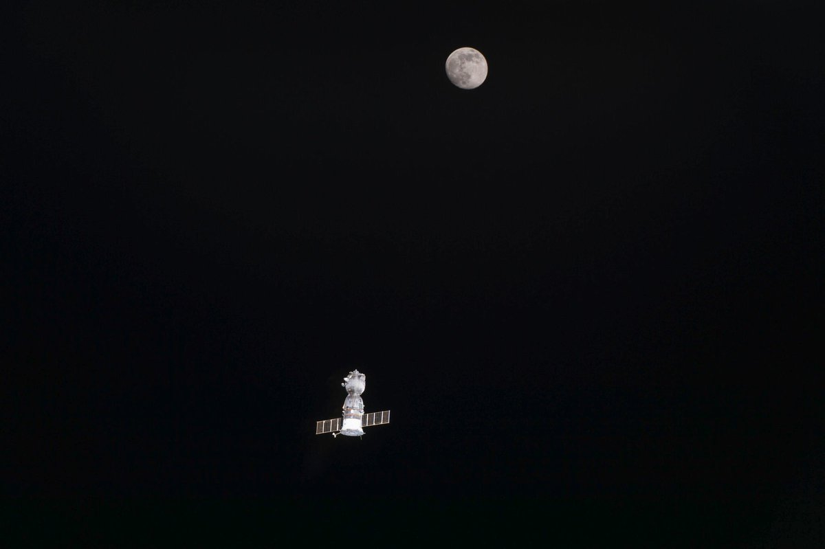 AmericaSpace's tweet photo. Departing #Soyuz and nearly full moon in this image from @Astro_Jeff as the #Exp46 crew returns to Earth. @Space_Station https://t.co/O6TJBvnNMP