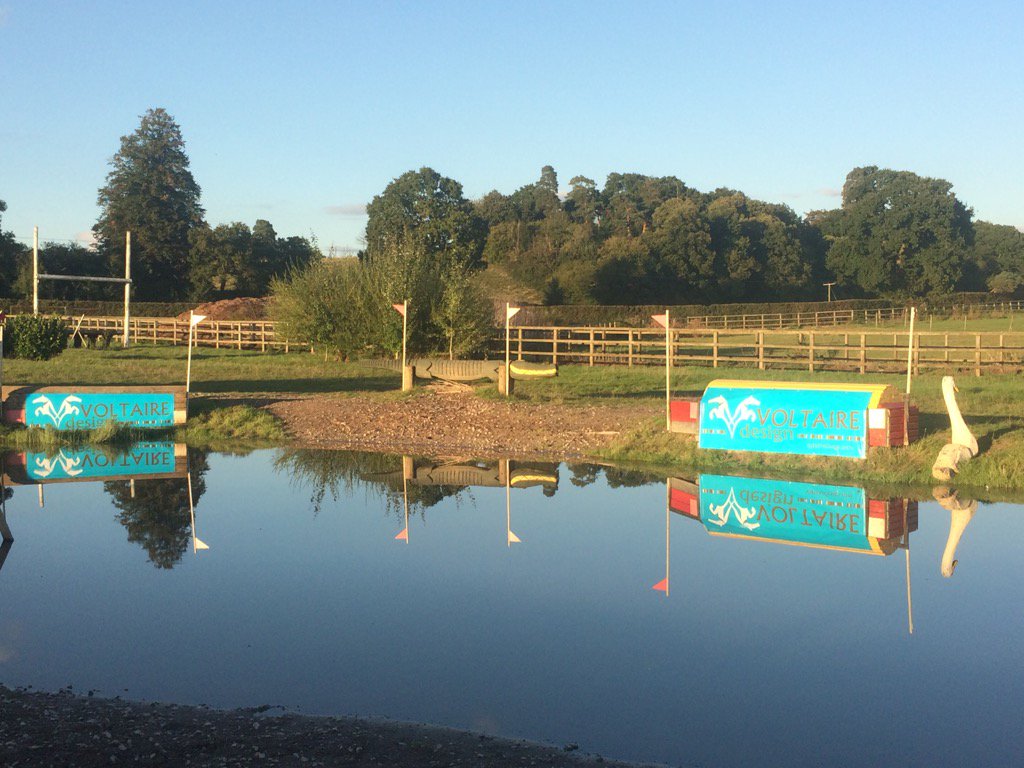 Guess who's sponsoring the Water Jump <a href="/LittletonHTs/">LittletonHorseTrials</a>?! <a href="/VoltaireDesign/">Voltaire Design</a> banners glistening in the late afternoon sun.