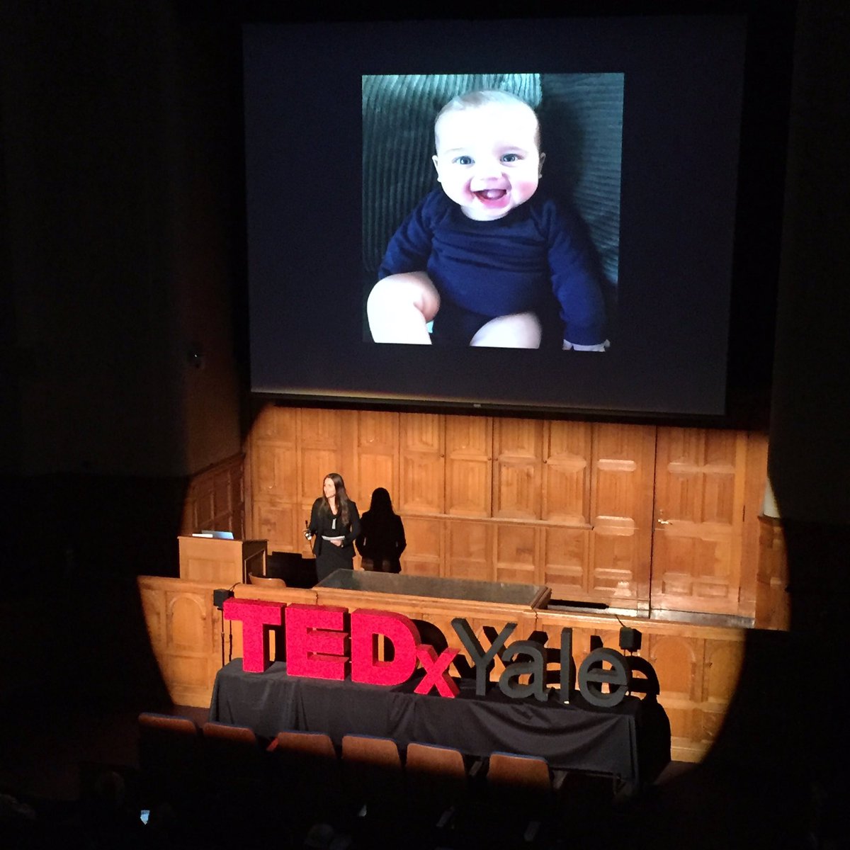 TEDxYALE's tweet photo. An adorable baby and Caitlin Molina on #ProvidenceTalks and closing the 30 million word gap! #TEDxYale2016 https://t.co/hC5c1YxOc0