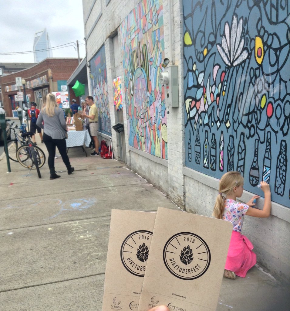 m_a_h_o_n_e_y's tweet photo. Teaching my niece about sustainable transportation, coloring therapy & CLT food. #BikeFestCLT https://t.co/oL8giIj5Y3