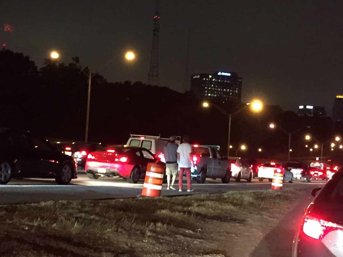 Major accident blocking all lanes of traffic in downtown Atlanta. People are whacking out. Dancing/twerking on cars and walking in road.