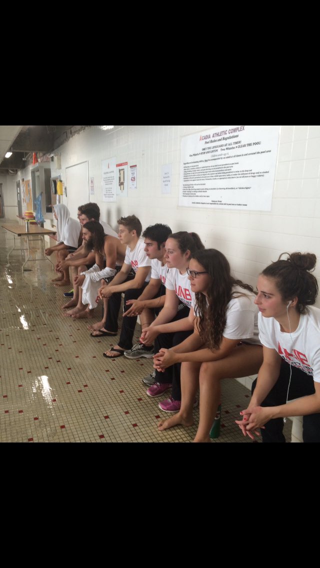 UNB_Swimming's tweet photo. Game faces on waiting for their events to come up!💪👊@VarsityReds #IAmVRed https://t.co/gcvkwYvw4m