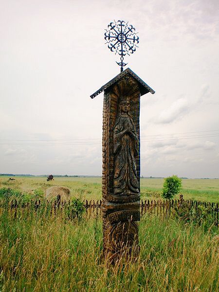Prechristian sun & moon cross at the top of a wooden monument. Christian & pagan traditions are intertwined in #Lithuania