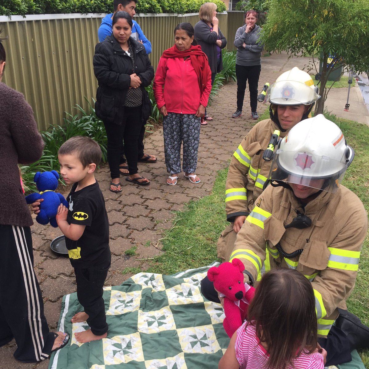 PhoebeBowden's tweet photo. Fire fighters give teddies to three children after blaze claims much of their home #TenNews https://t.co/9CQ1McioYC