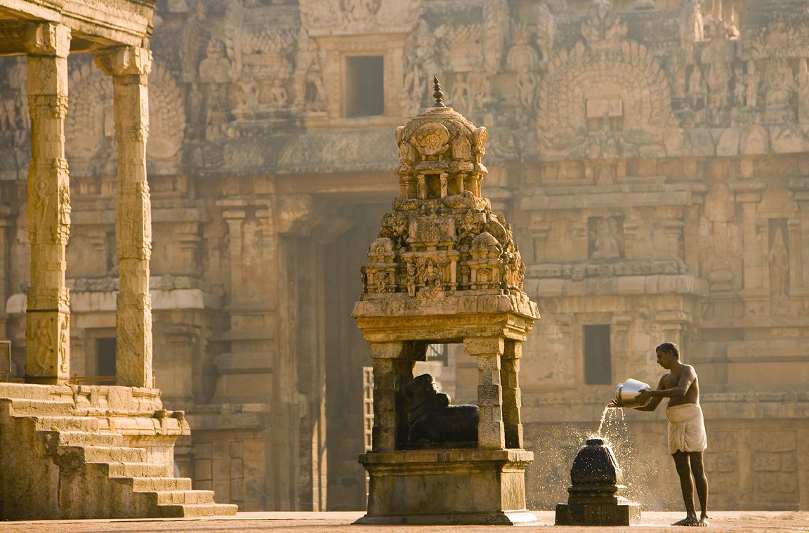 Waking up the gods - A priest performs the early morning rituals at the 1000-year old Brihadeeswarar Temple #TamilNadu