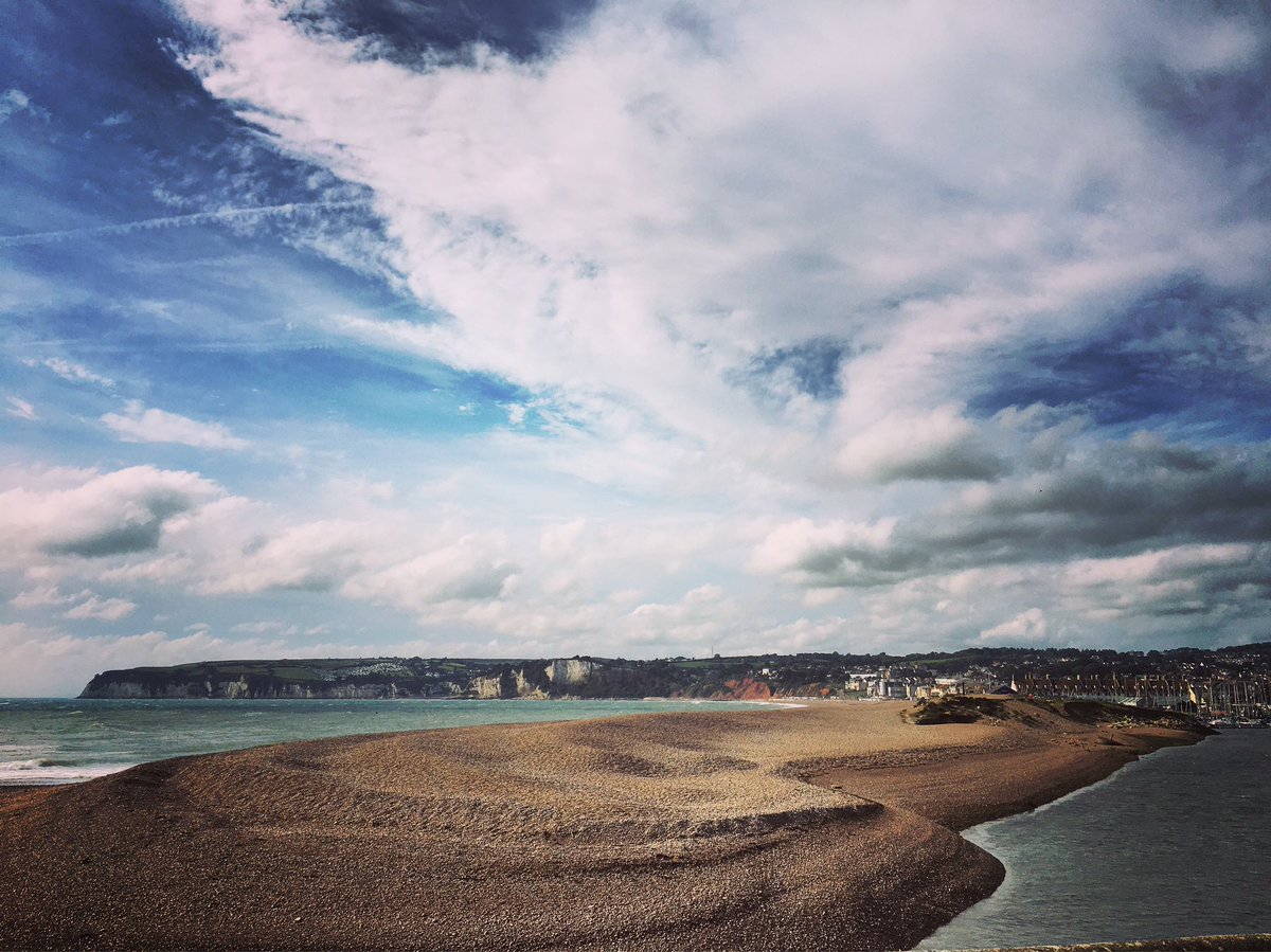 The wonderful view from the mouth of the River Axe looking towards Seaton and Beer.