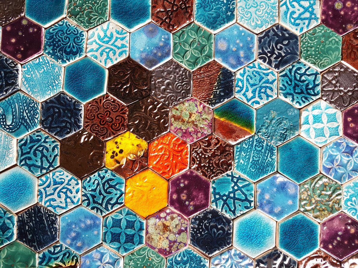 I've been working on a slightly different project this week, tiny hexagon tiles.  I can't wait to see them all finished!