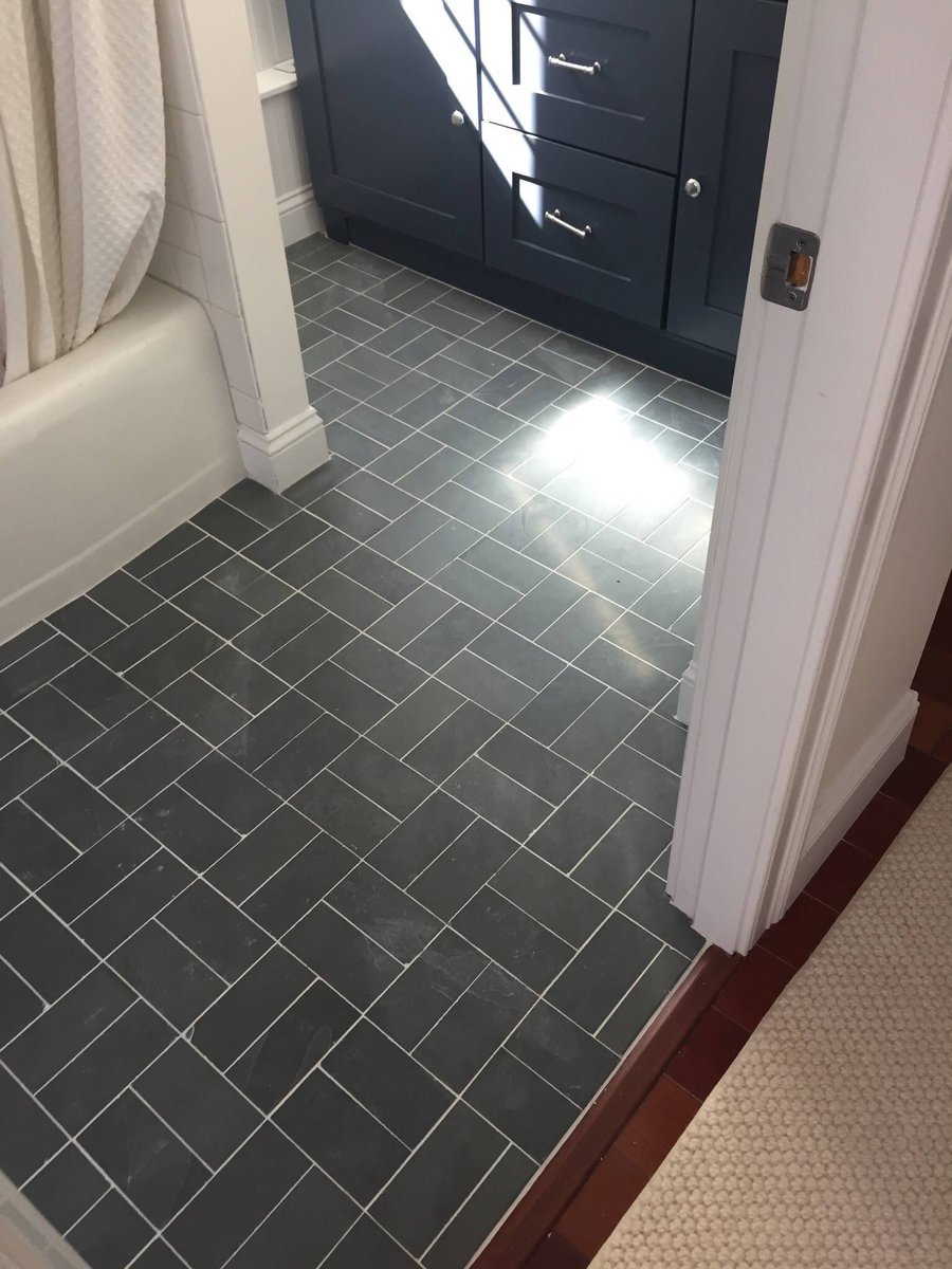 3x6 Brazilian Black Slate bathroom floor with Bright White grout to match  the fixtures and highlight the tile layout. Awesome work team Zen!, image size:900x1200
