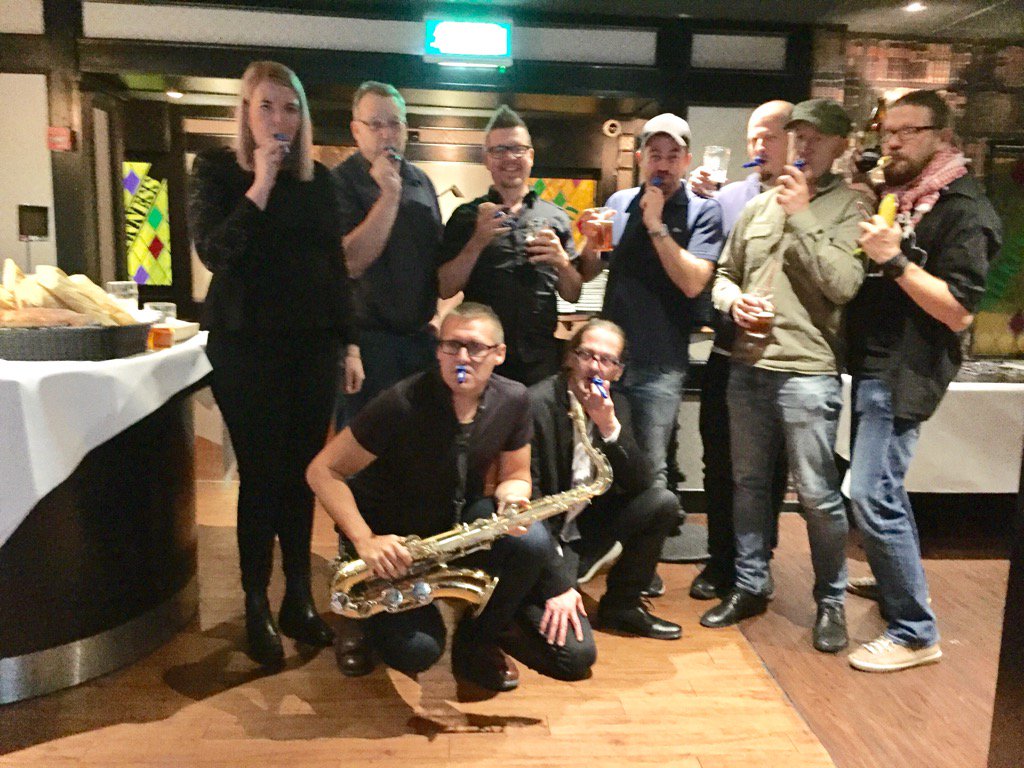 shayman's tweet image. The #MacSysAdmin band. One sax and seven kazoos.