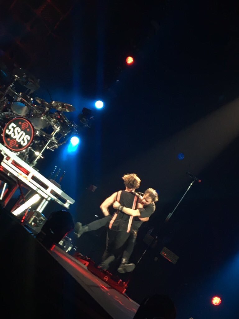 bigdickenergy's tweet photo. Michael getting carried off stage by Ashton in Leeds #SLFLLeeds https://t.co/KopI4L5aS3