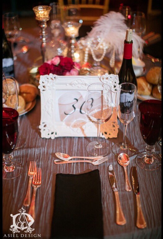 asieldesign's tweet photo. #prohibition meets #gatsby #feathers #gold #tablenumber #dining #glassware #red #blog https://t.co/1Jy7Yxq9nk https://t.co/wlQtplE3M0