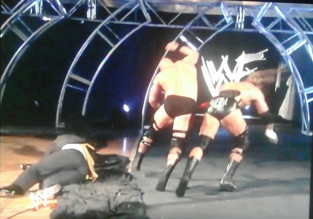 Mundo840's tweet photo. Immediately Vince takes Sledgie away from Triple H. H decks Vince who takes a funny fall. Austin attacks and we're underway!! #NoMercy99 https://t.co/4wStslyl7S