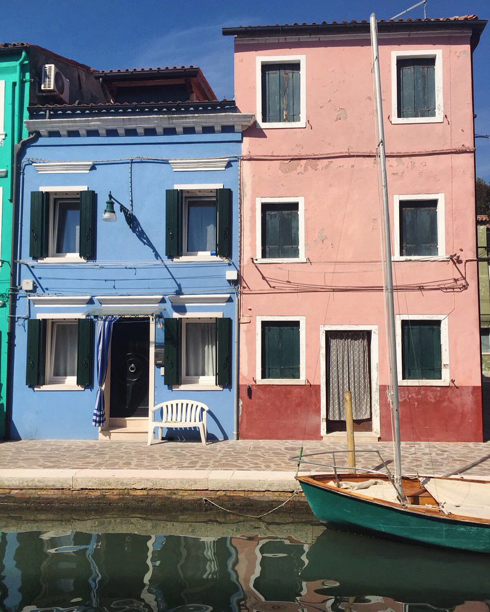 Visiting Burano is like walking through a rainbow of colorful houses. Have you visited? #Venice