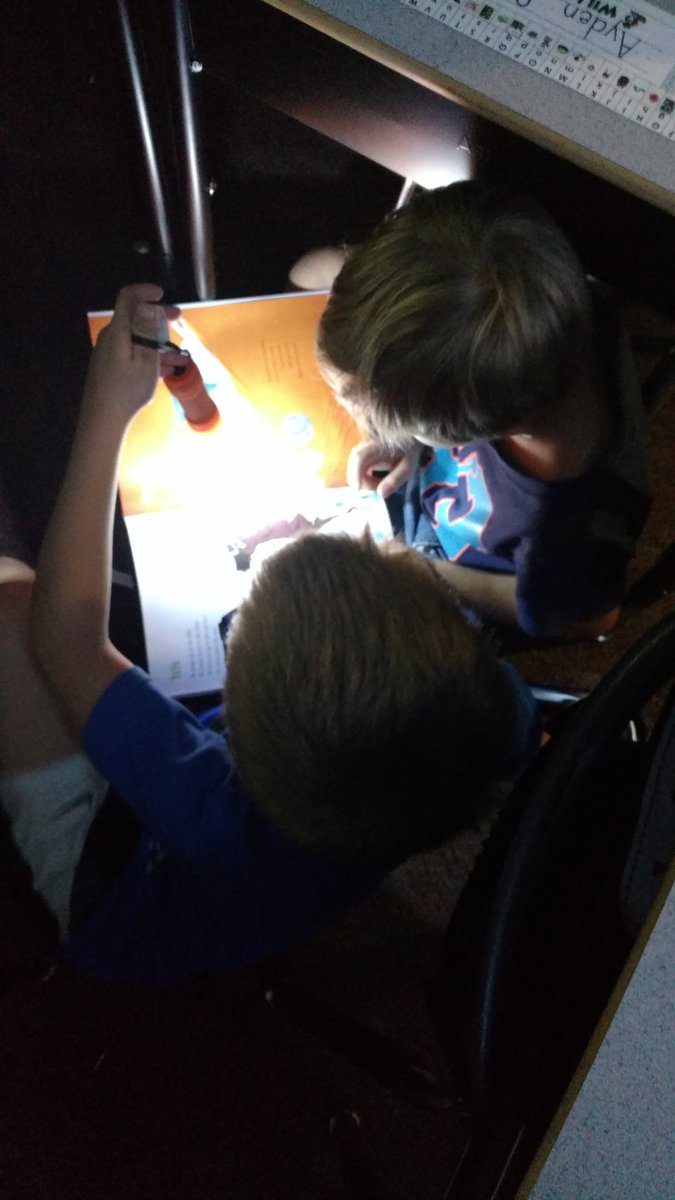 Mrs_Broughton's tweet photo. Some flashlight reading on this cool, rainy Friday... #WeAreWCE https://t.co/5hKESRYSix