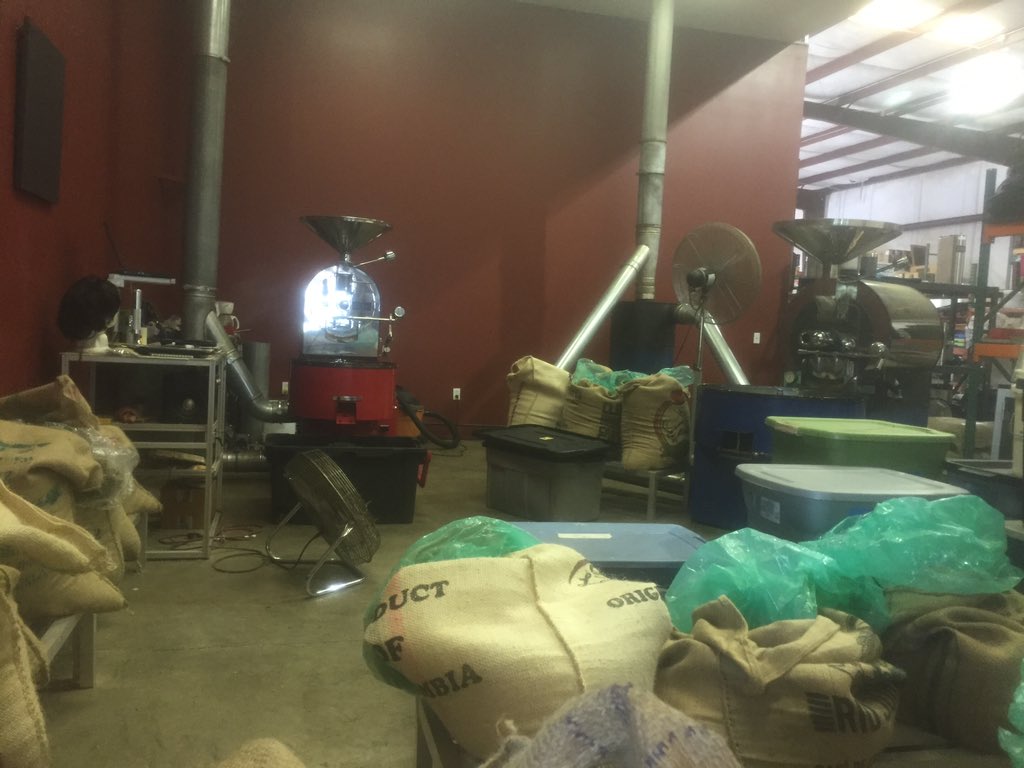 Studying the <a href="/LuckyGoatCoffee/">Lucky Goat Coffee</a> roasting operation while sipping a cup of their roaster's blend.