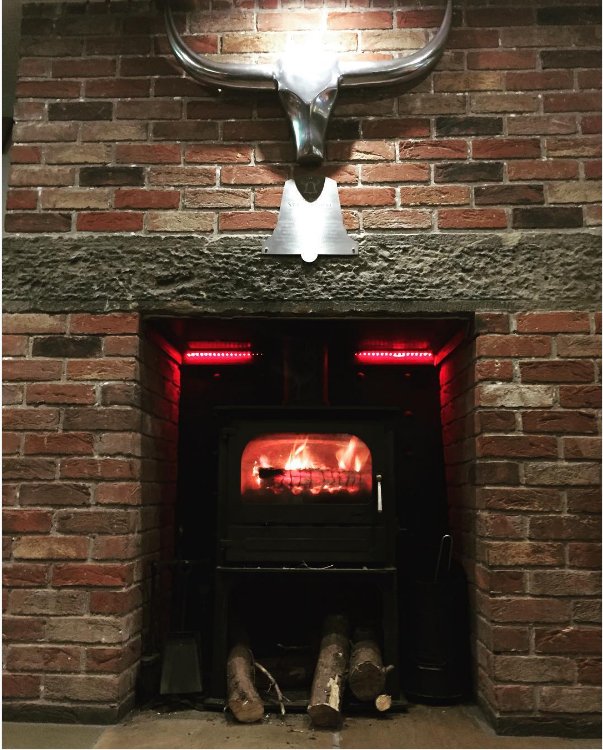 It may be cold outside but its lovely and warm around our bar tonight! #winterwarmer #logburner