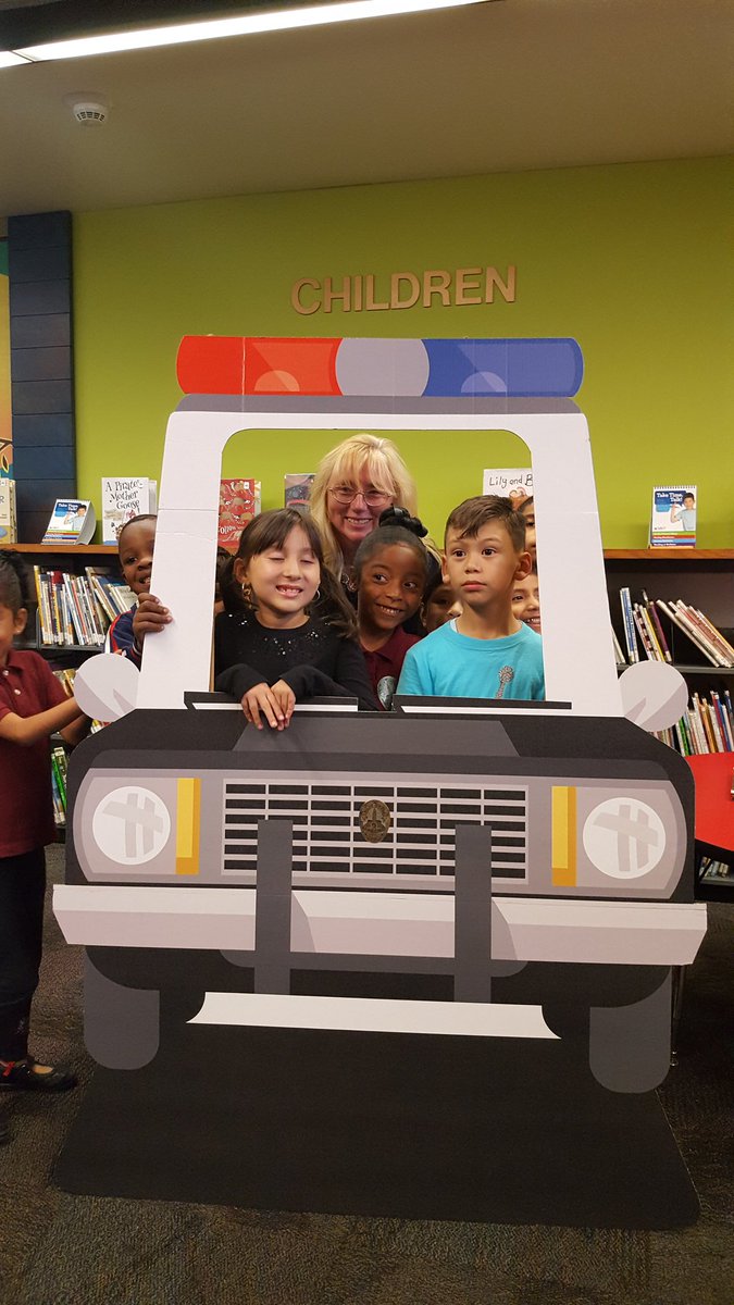 LAPDHQ's tweet photo. Our day continued w/ @USAttyDecker bringing smiles to kids @ our @LAPublicLibrary &amp; #LAPD  #readalong @ Vernon Branch Library in @NewtonLAPD https://t.co/eKcTXc5uiW