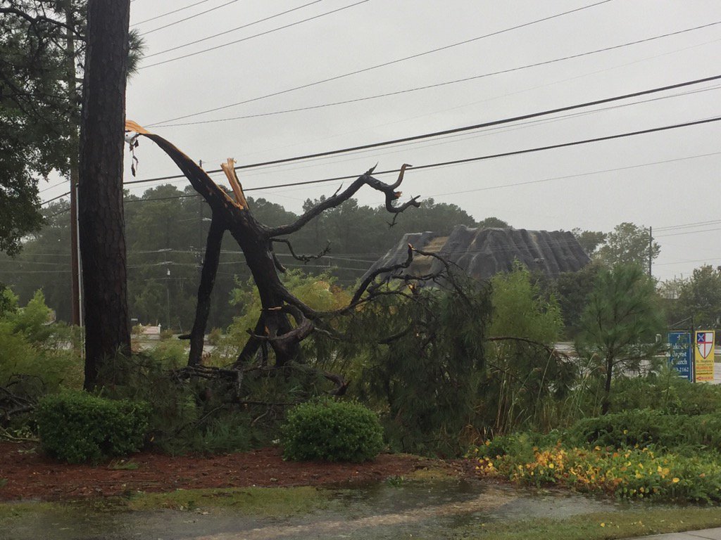 meredithhelline's tweet photo. Tornado path at 11th Ave N and US 17. Flooding. Downed power line. Mellow Mush and @Carrabbas look ok from here https://t.co/0m3OyqEG8W