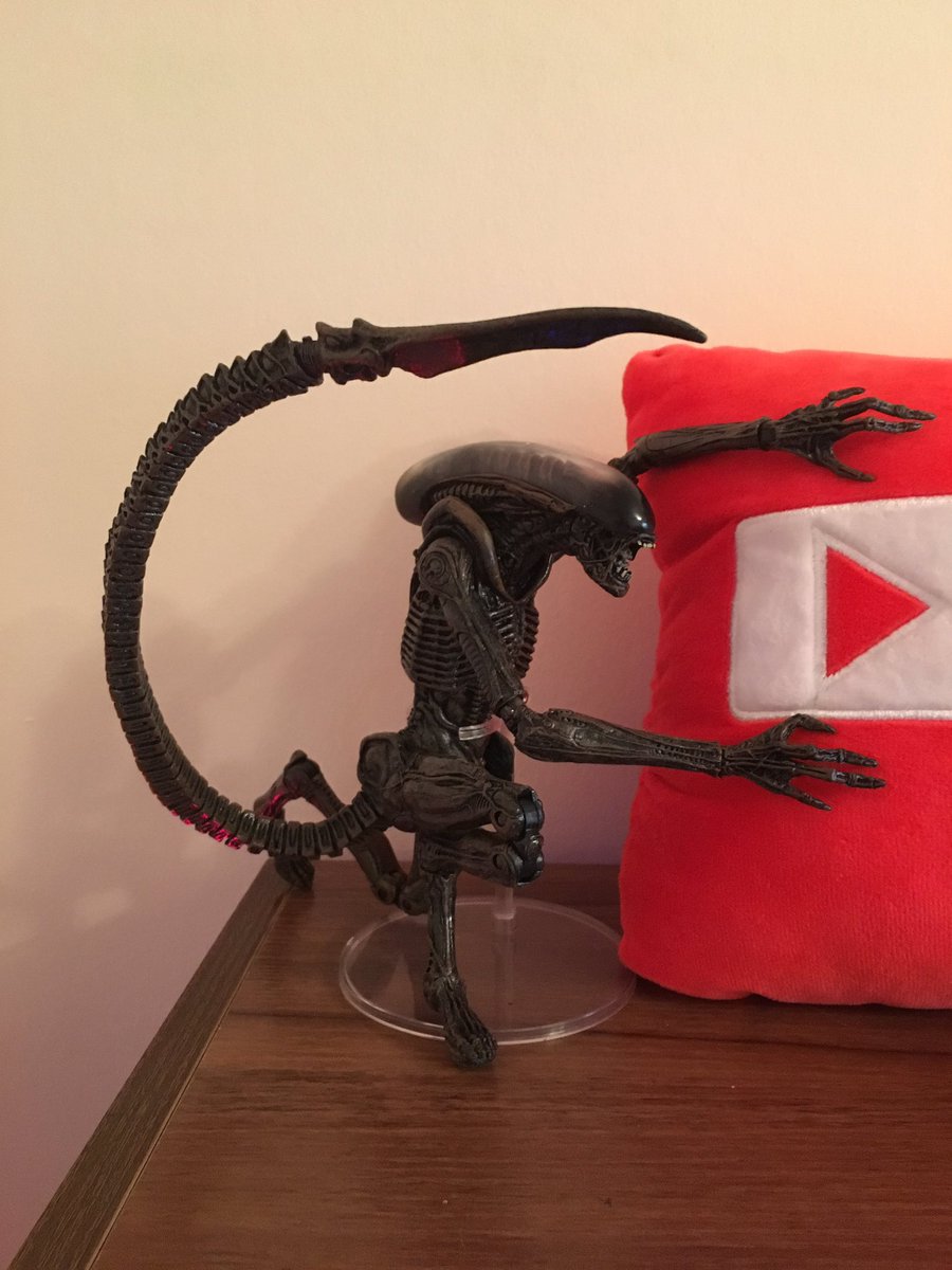 Sethum83's tweet photo. Check out my new prop! I got an Alien Dog Action figure for my shelf and he seems to like my #Subscribe cushion. What do you think of it? https://t.co/t1cL2zVxUQ