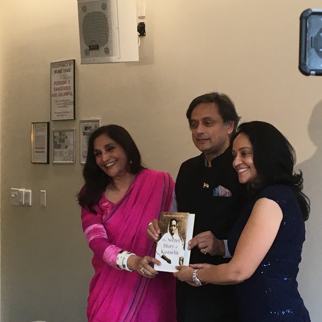 LakshmiGandhi's tweet photo. '@ShashiTharoor helps unveil the new book on Kasturba Gandhi #IAACLitfest2016 https://t.co/5zwzr6QOLs