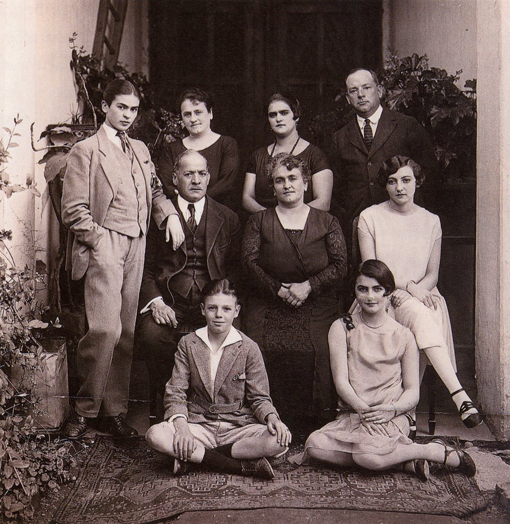 Frida Kahlo wearing a suit in a family photo, circa 1924. | History In ...
