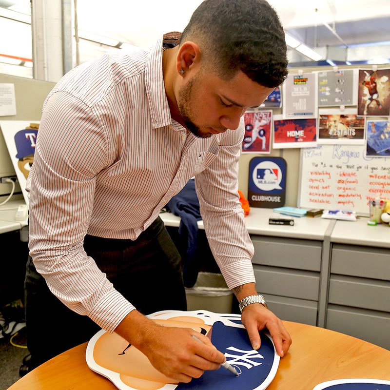 MLB's tweet photo. .@ElGarySanchez came to our social HQ and signed FIVE @mlb.com Clubhouse emoji printouts. 

Want one? RT for your chance to win. https://t.co/iLuFhad6RQ