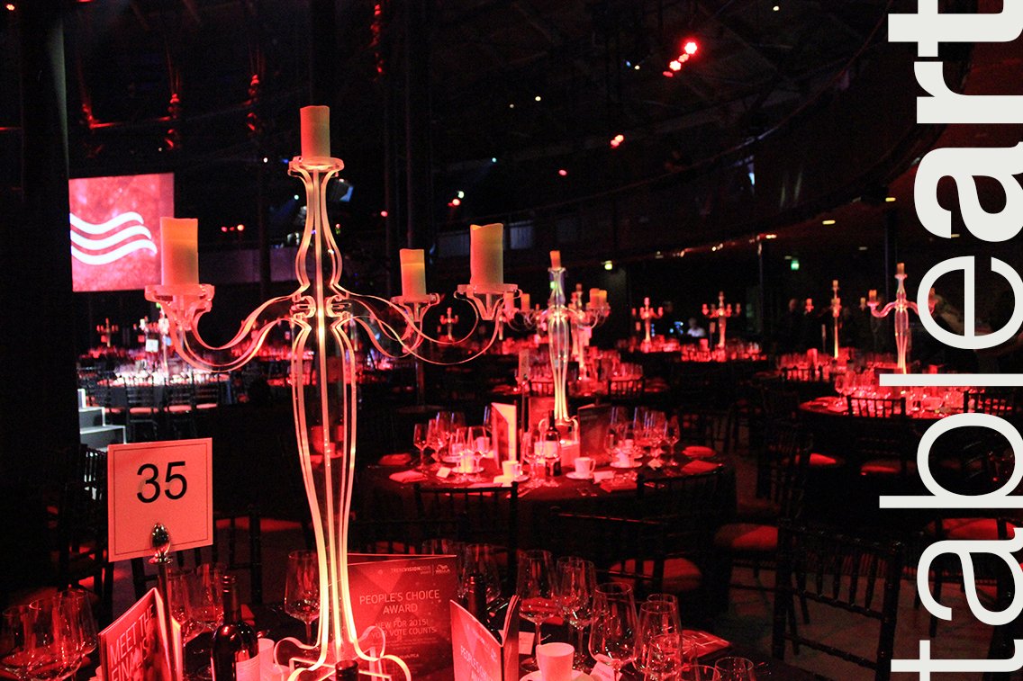 In a vivid scarlet, the clear candelabra cuts a dramatic scene inside the <a href="/RoundhouseLDN/">Roundhouse</a> with <a href="/VenueselectLLP/">Venue-Select®</a> for an event this evening.