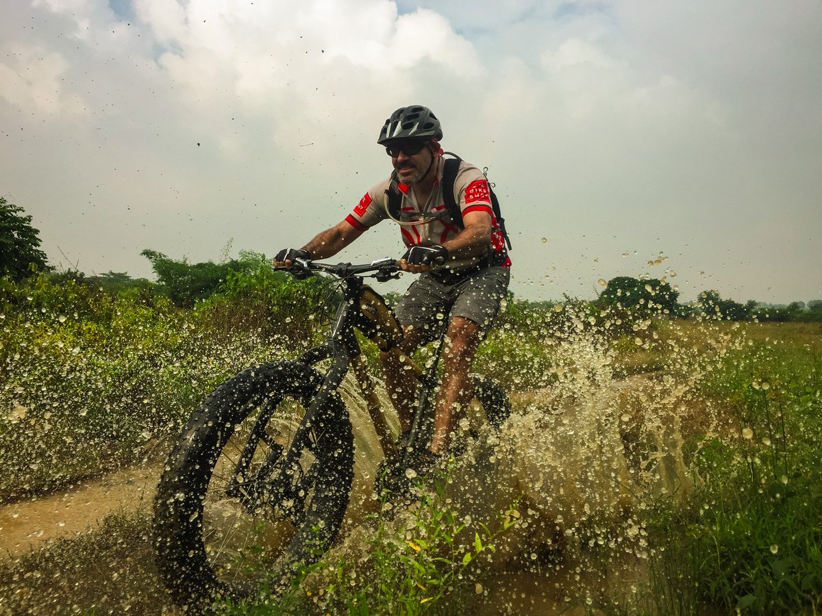 .<a href="/jwolfdesign/">James Wolf</a> of <a href="/BooBicycles/">Boo Bicycles</a> and <a href="/TheBikeShopVN/">TheBikeShopVN</a> rolls through a puddle on his #custom built #bamboo #fatbike.