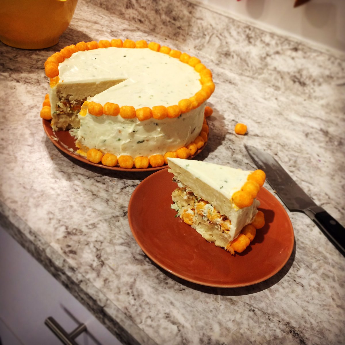 FalynnK's tweet photo. Another #macandcheese #cake! This time for @billy_penn and eaten by @indyhall 
white cheddar, jalapeño flecks, cheesy poofs, bacon #FallyMac https://t.co/9XCKwWwnCx