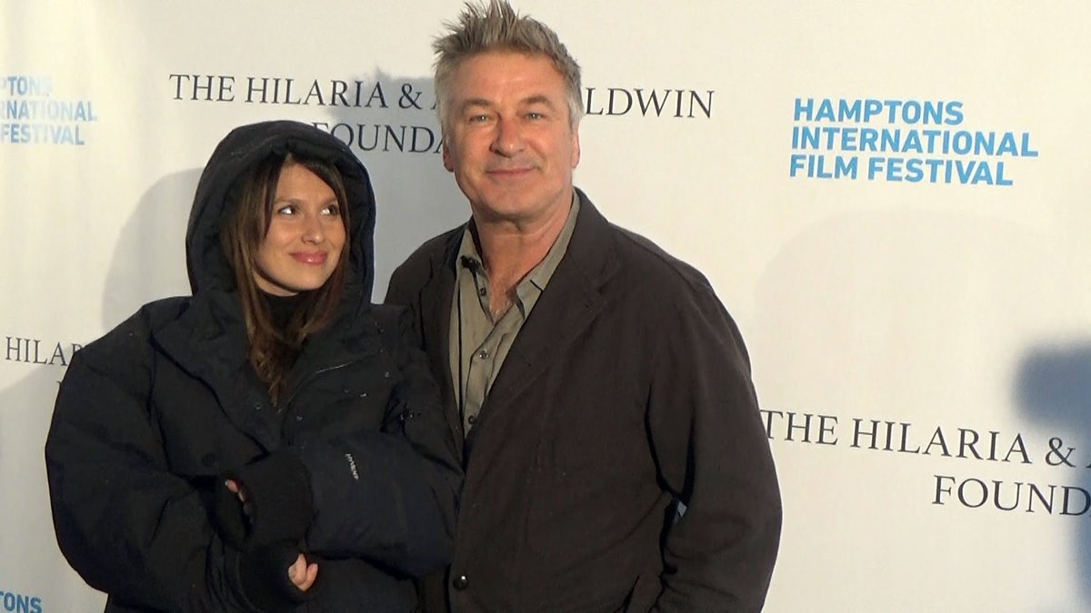 hamptonsmedia's tweet photo. Just LOVE this of Alec + Hilaria @HamptonsFilm Chairman's Reception protected from remnants of Hurricane Matthew on red carpet! #thehamptons https://t.co/QSlCkIovuz