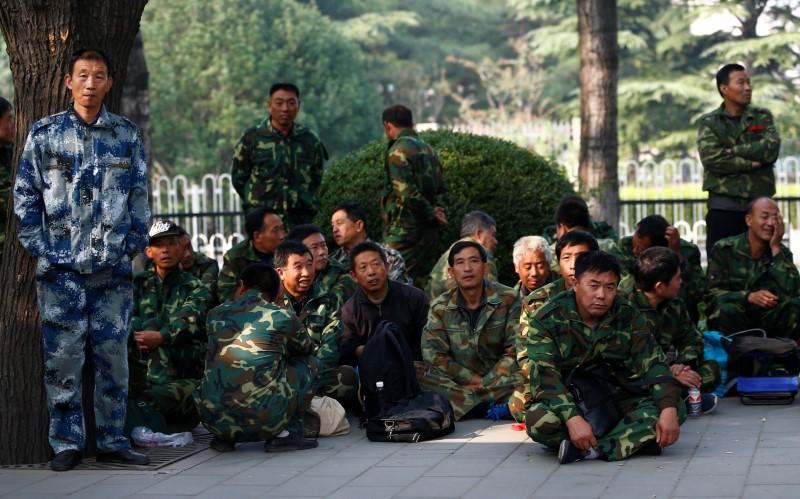Reuters's tweet image. China blockades streets around military building as hundreds protest in capital reut.rs/2d5711N
