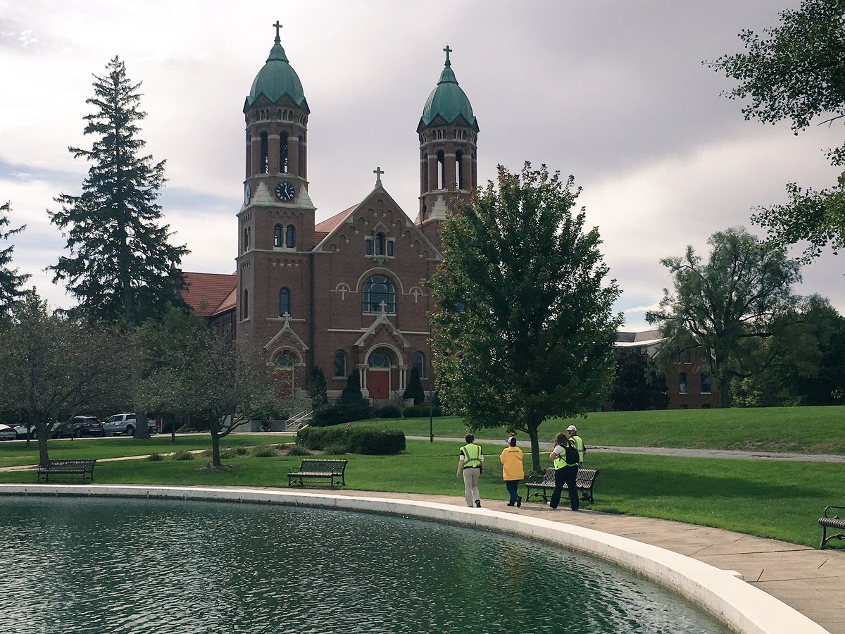 INTorchRelay's tweet photo. The torch makes its way around the fountain at St. Joseph's College! https://t.co/1cawcysTLc