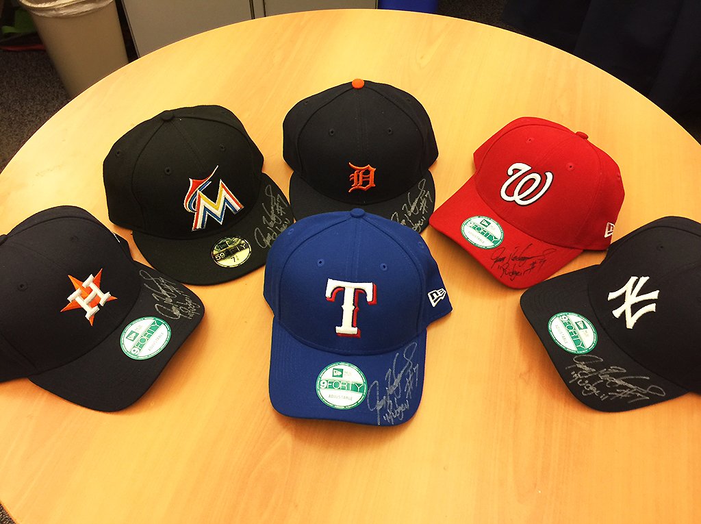 MLB's tweet photo. .@Pudge_Rodriguez, boss that he is, signed 6 caps for us – one for each club he played on. Want one? Just reply with which team you’d like! https://t.co/JwMLVQPadO