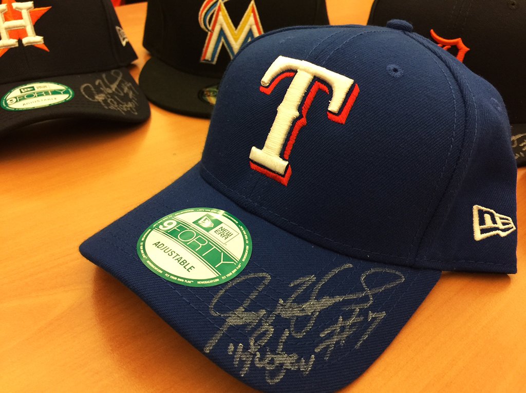 MLB's tweet photo. .@Pudge_Rodriguez, boss that he is, signed 6 caps for us – one for each club he played on. Want one? Just reply with which team you’d like! https://t.co/JwMLVQPadO